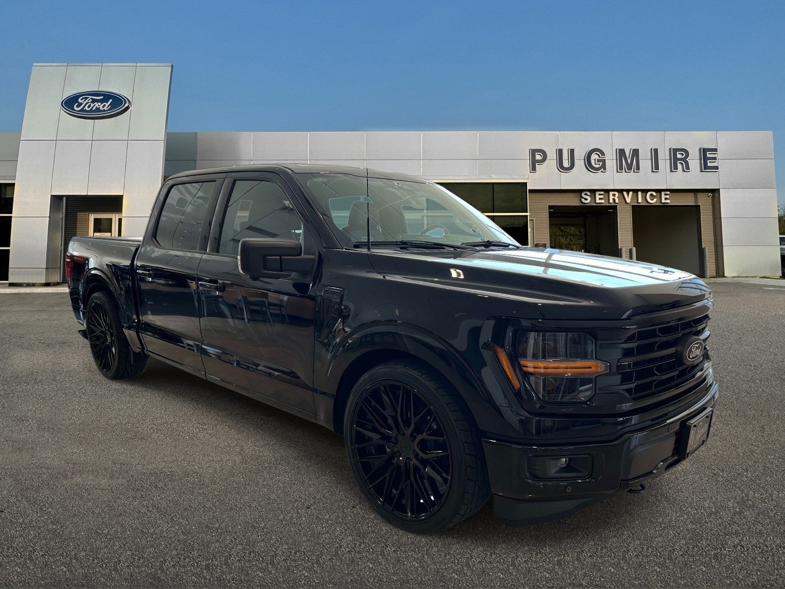 2026 Ford F-150 XLT 4WD Pug Performance Edition in Agate Black Met — front three-quarter view