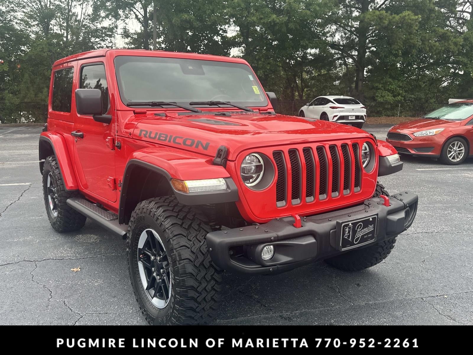 2021 Jeep Wrangler Rubicon in Firecracker Red Clearcoat — front three-quarter view